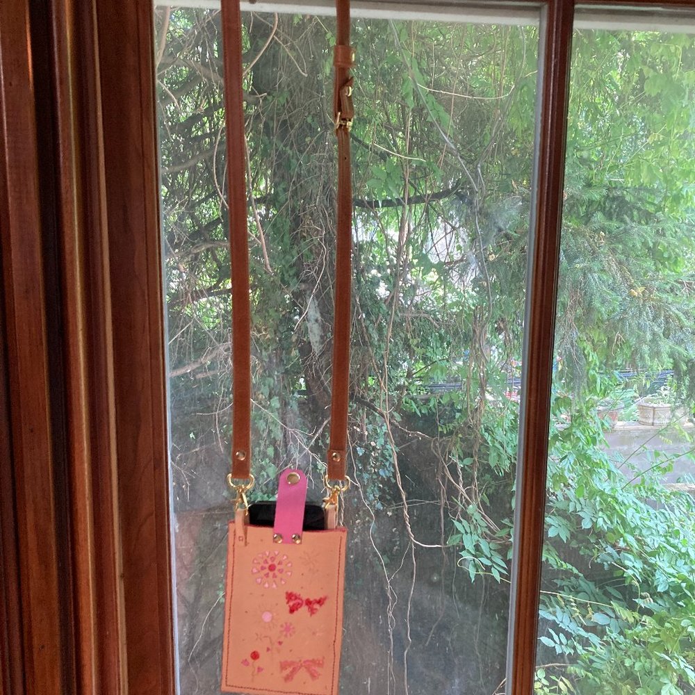 Cross body cell phone carrier